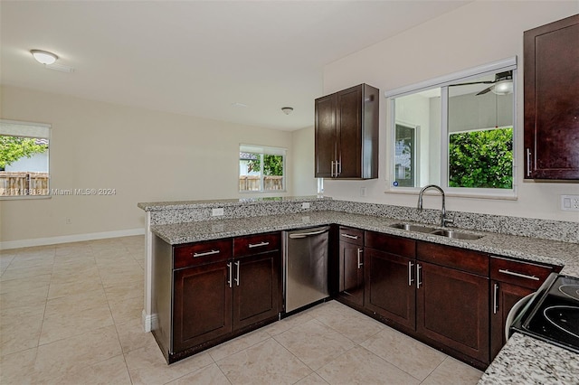 kitchen with light stone countertops, ceiling fan, sink, dishwasher, and range