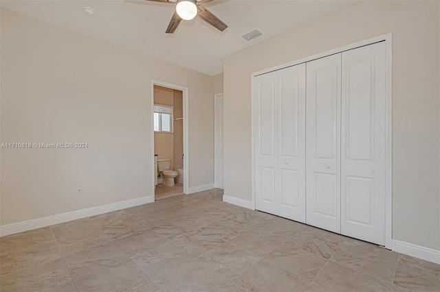 unfurnished bedroom with connected bathroom, ceiling fan, and a closet