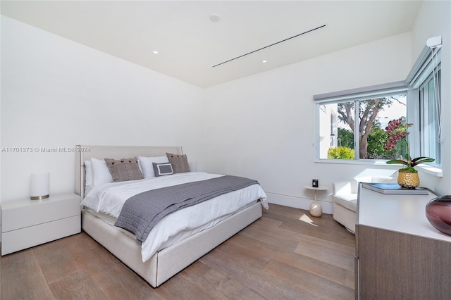 bedroom with light wood-type flooring