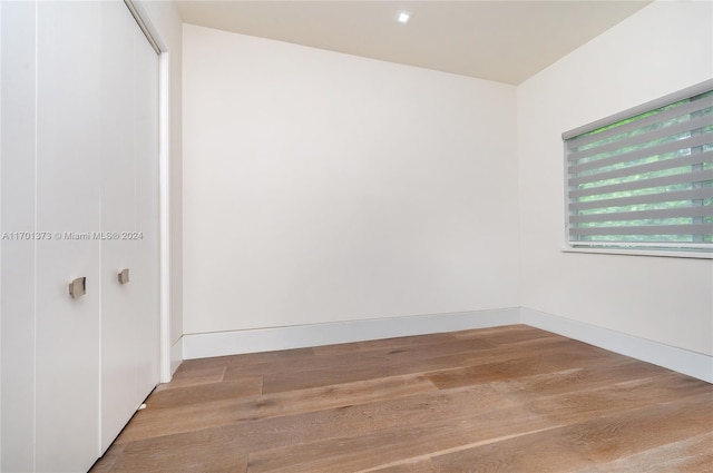 spare room featuring hardwood / wood-style flooring