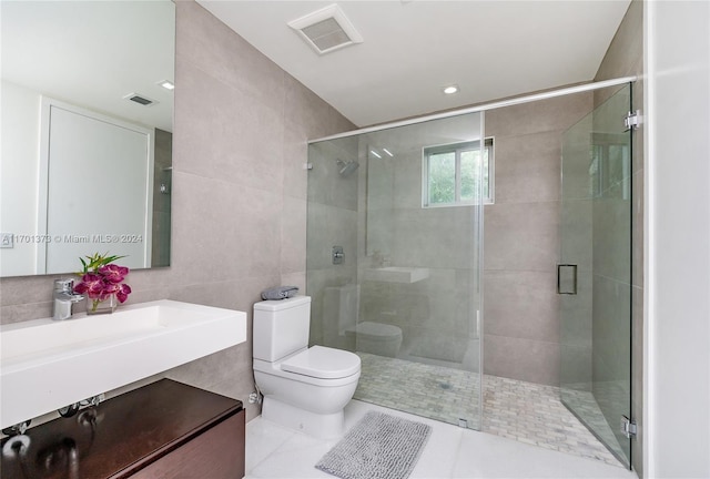 6301 SW 114th St, Pinecrest, FL 33156 - full bathroom with tile walls, vanity, a shower stall, and tile patterned flooring