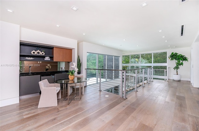 living room featuring light hardwood / wood-style floors and sink