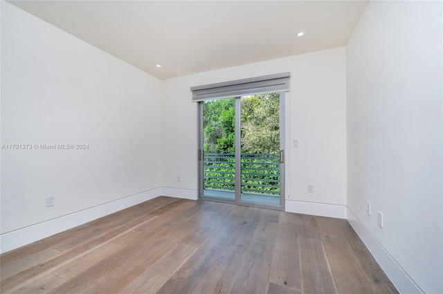 spare room with light hardwood / wood-style flooring