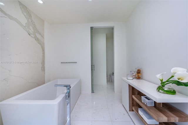 bathroom featuring toilet and a tub