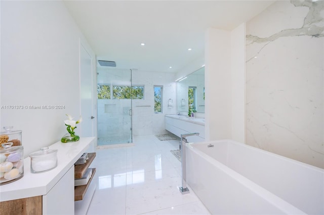 bathroom featuring vanity and plus walk in shower