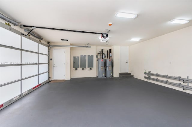 garage featuring electric panel, electric water heater, and a garage door opener