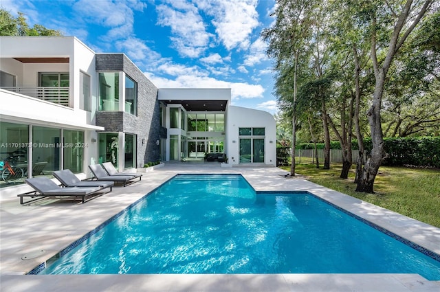 view of swimming pool featuring a patio area