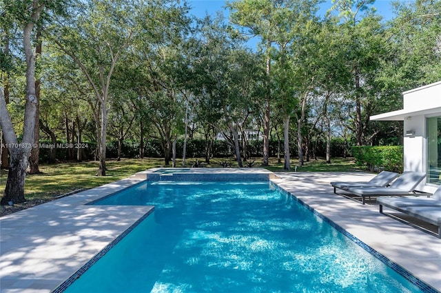 6301 SW 114th St, Pinecrest, FL 33156 - view of swimming pool with a patio area, a pool with connected hot tub, view of scattered trees, and a yard