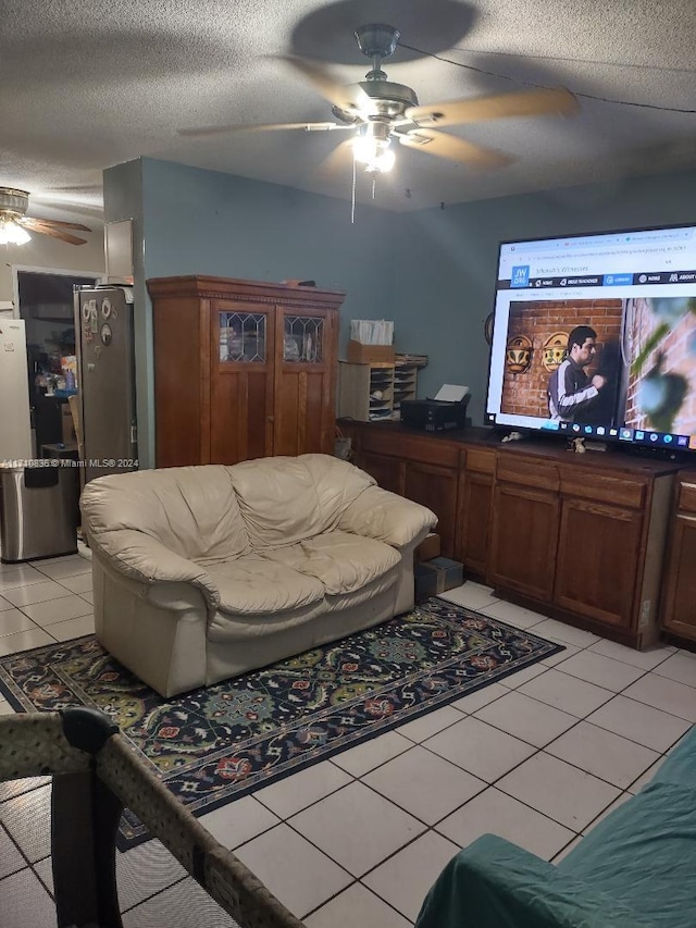 living room with light tile patterned floors and a textured ceiling