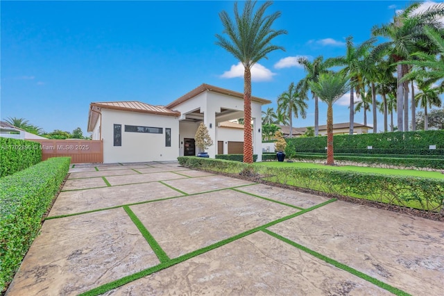 rear view of property featuring a patio