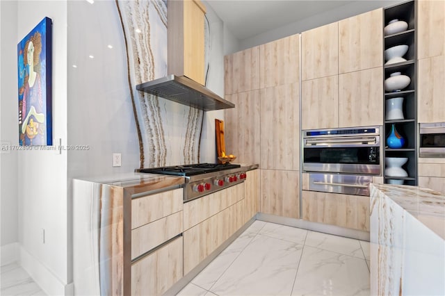 kitchen with light brown cabinets, wall chimney exhaust hood, and stainless steel appliances