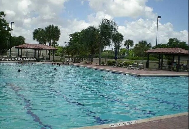 view of swimming pool with a gazebo