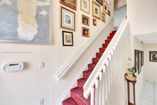 staircase with tile patterned floors