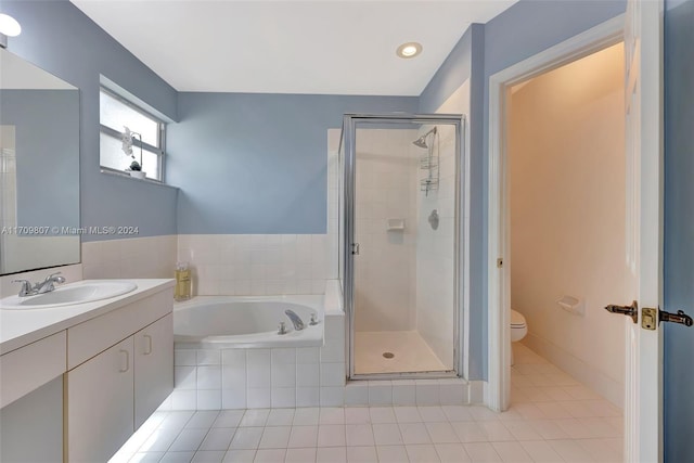 full bathroom with tile patterned floors, vanity, toilet, and shower with separate bathtub