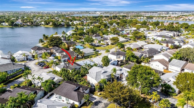 birds eye view of property featuring a water view