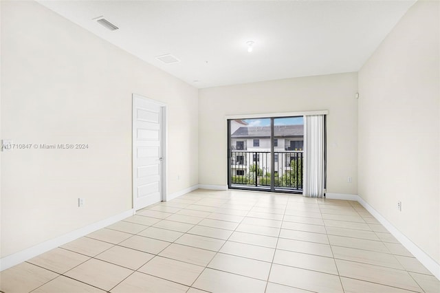 spare room with light tile patterned floors