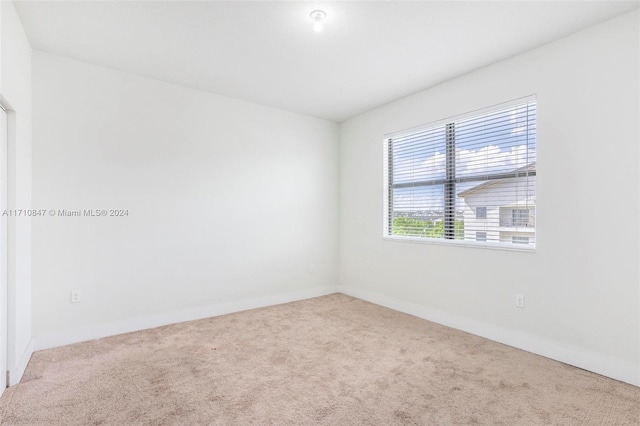 unfurnished room with carpet