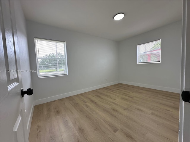 unfurnished room featuring light hardwood / wood-style flooring