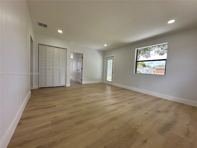 unfurnished bedroom with light hardwood / wood-style floors