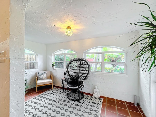 sitting room with tile patterned floors