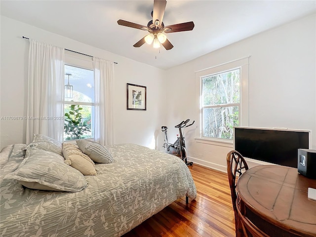 bedroom featuring hardwood / wood-style floors and ceiling fan