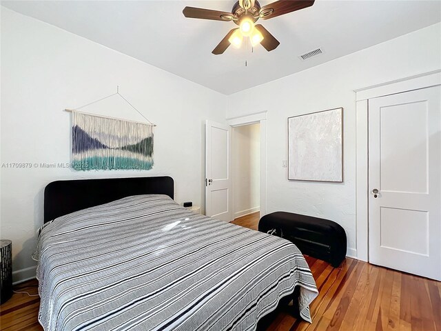 bedroom featuring hardwood / wood-style flooring and ceiling fan