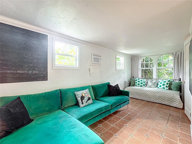 tiled living room with a wall mounted air conditioner, plenty of natural light, and ornamental molding