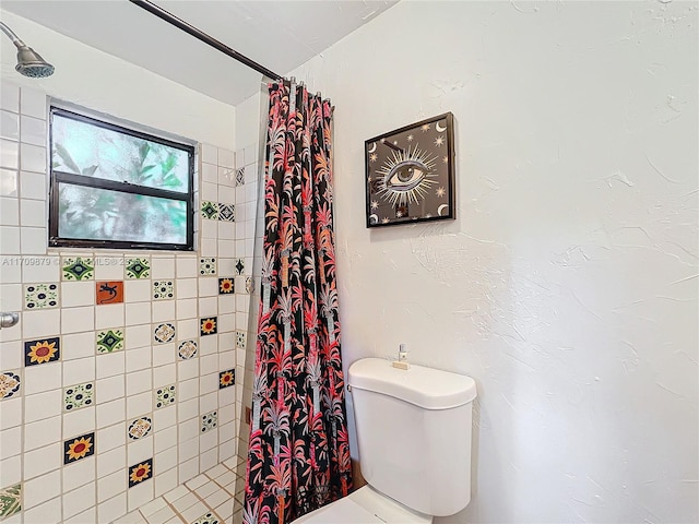 bathroom with toilet and walk in shower