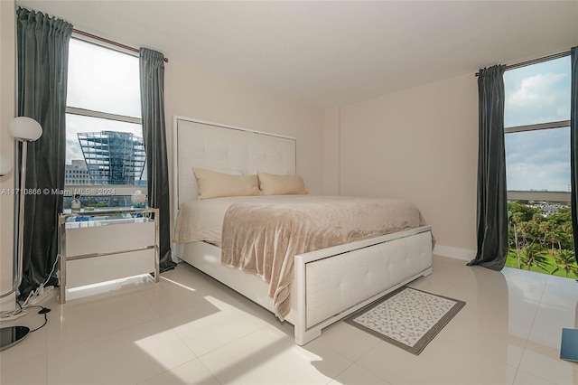 bedroom with light tile patterned floors