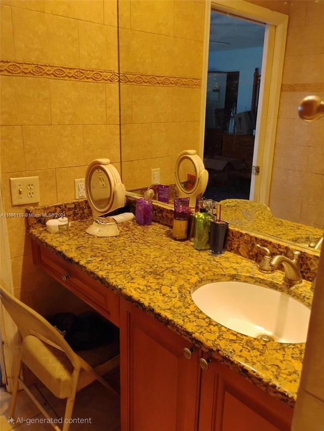 bathroom with vanity and tile walls