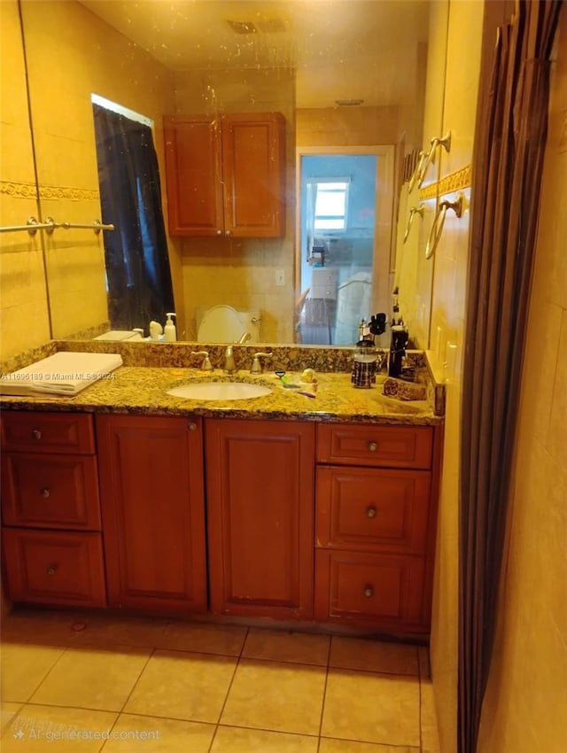 bathroom with tile patterned flooring and vanity