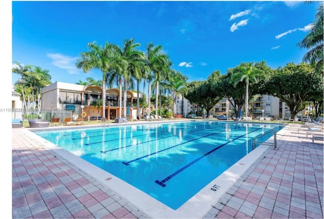 view of swimming pool featuring a patio area