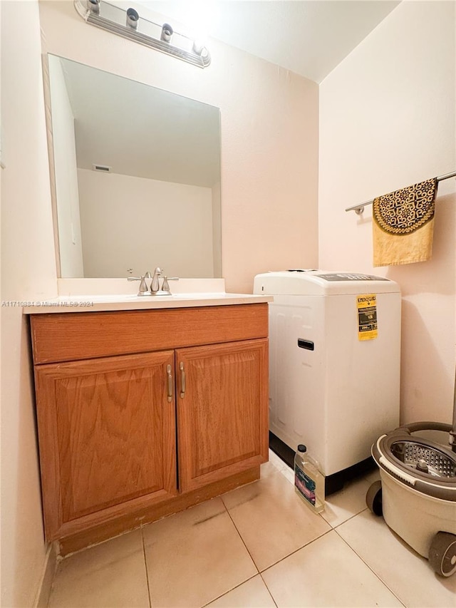 bathroom featuring tile patterned floors, vanity, and toilet