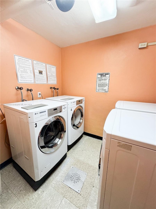 laundry room with separate washer and dryer