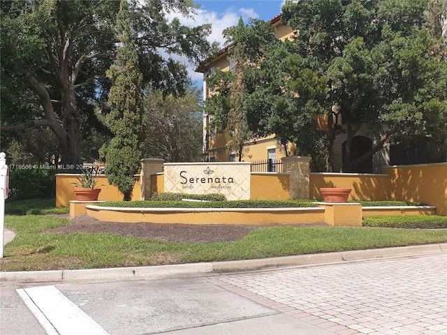 community sign with fence