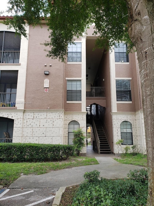 view of property featuring stairway