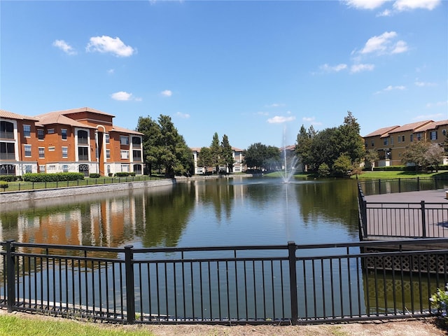 view of water feature with fence