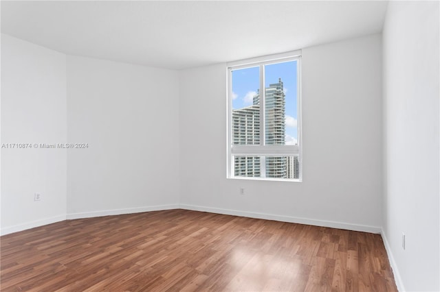 spare room featuring hardwood / wood-style flooring