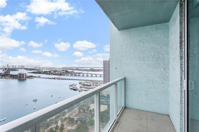 balcony featuring a water view