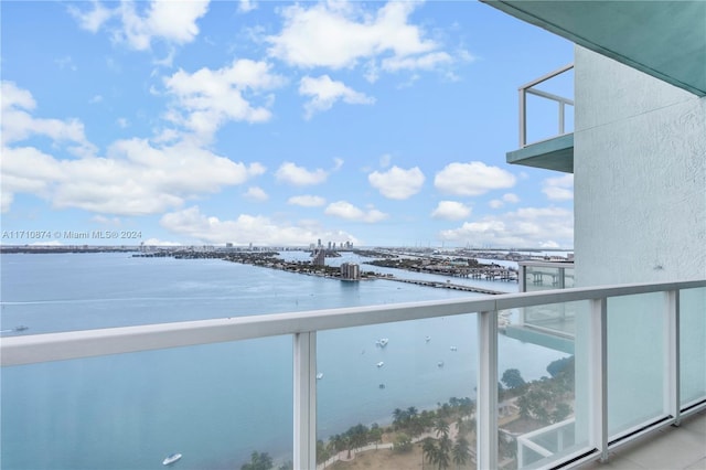 balcony featuring a water view