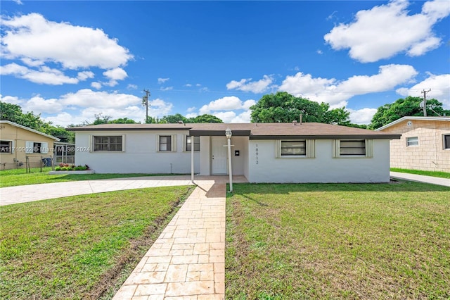 ranch-style house with a front yard