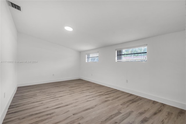 unfurnished room with light hardwood / wood-style flooring