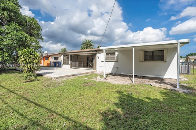 rear view of house with a lawn