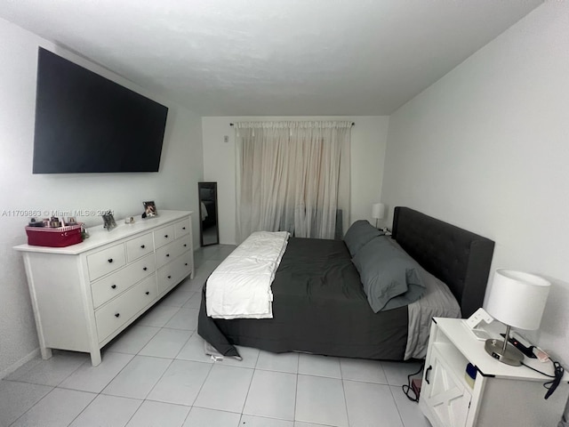 bedroom featuring light tile patterned floors