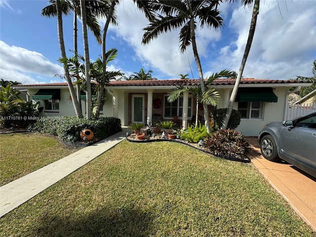 view of front of home with a front lawn