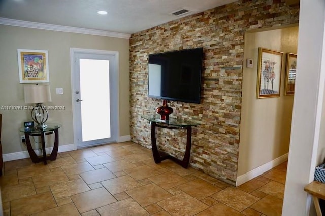 living room with plenty of natural light and ornamental molding