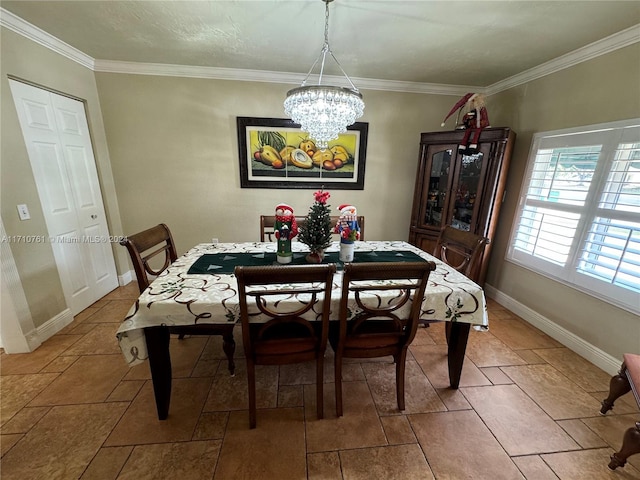 dining space with crown molding and a chandelier