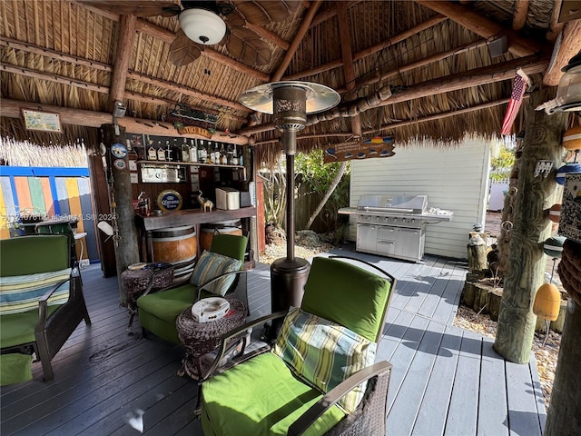 wooden deck featuring a gazebo, area for grilling, and ceiling fan