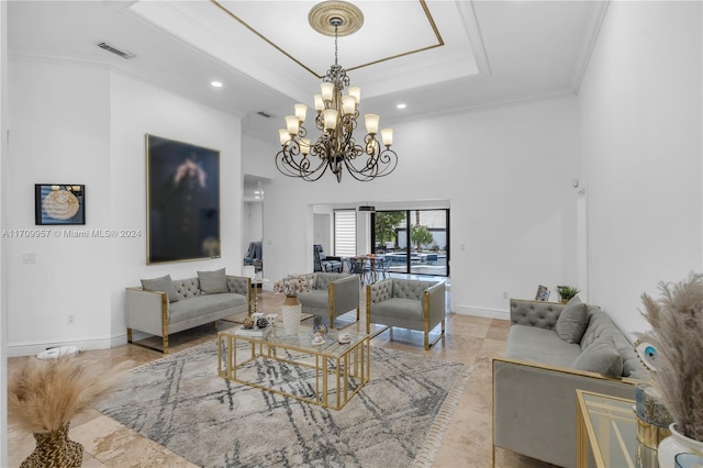 living room featuring a chandelier and ornamental molding