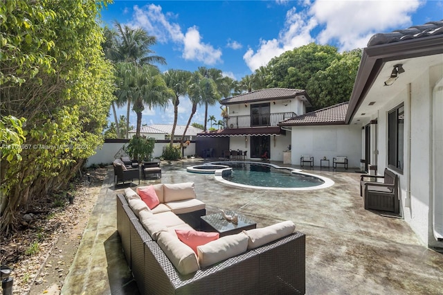 view of pool with an outdoor living space and a patio